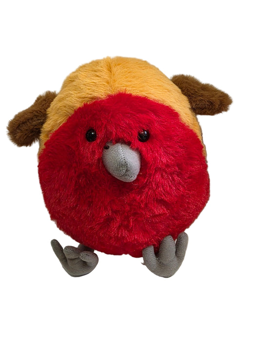 Plush toy resembling a bird with red face and yellow body on a white surface