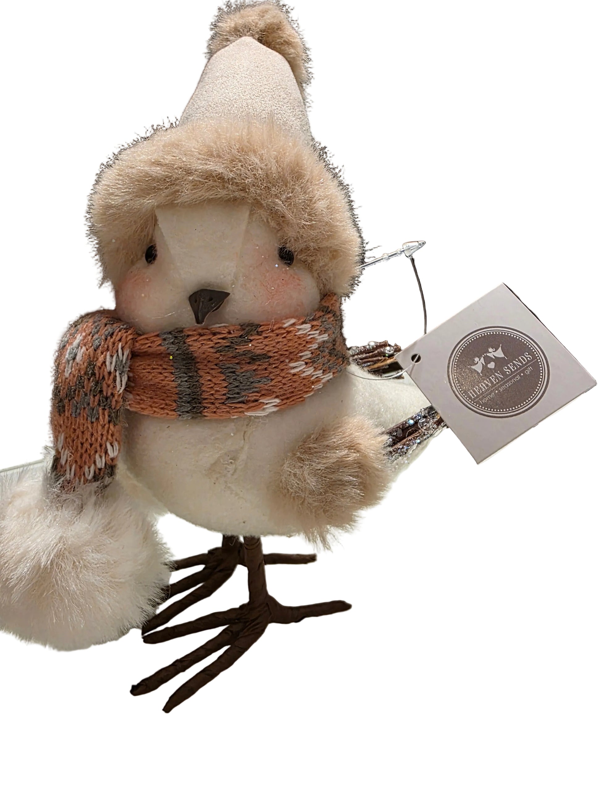 Plush bird toy with a hat and scarf, attached to a tag, on a white background