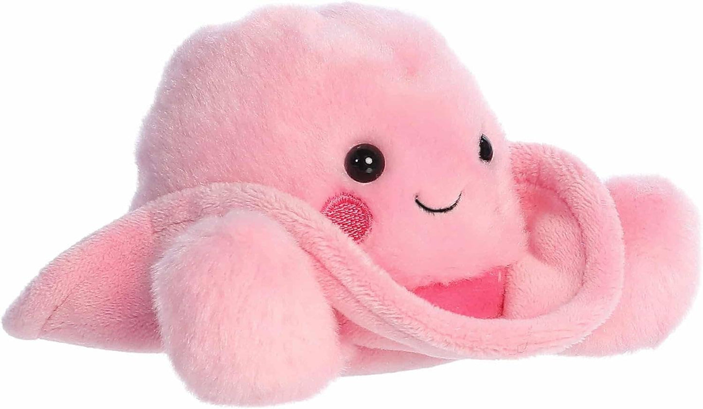 Pink plush cowboy hat toy with a smiling face on a white background