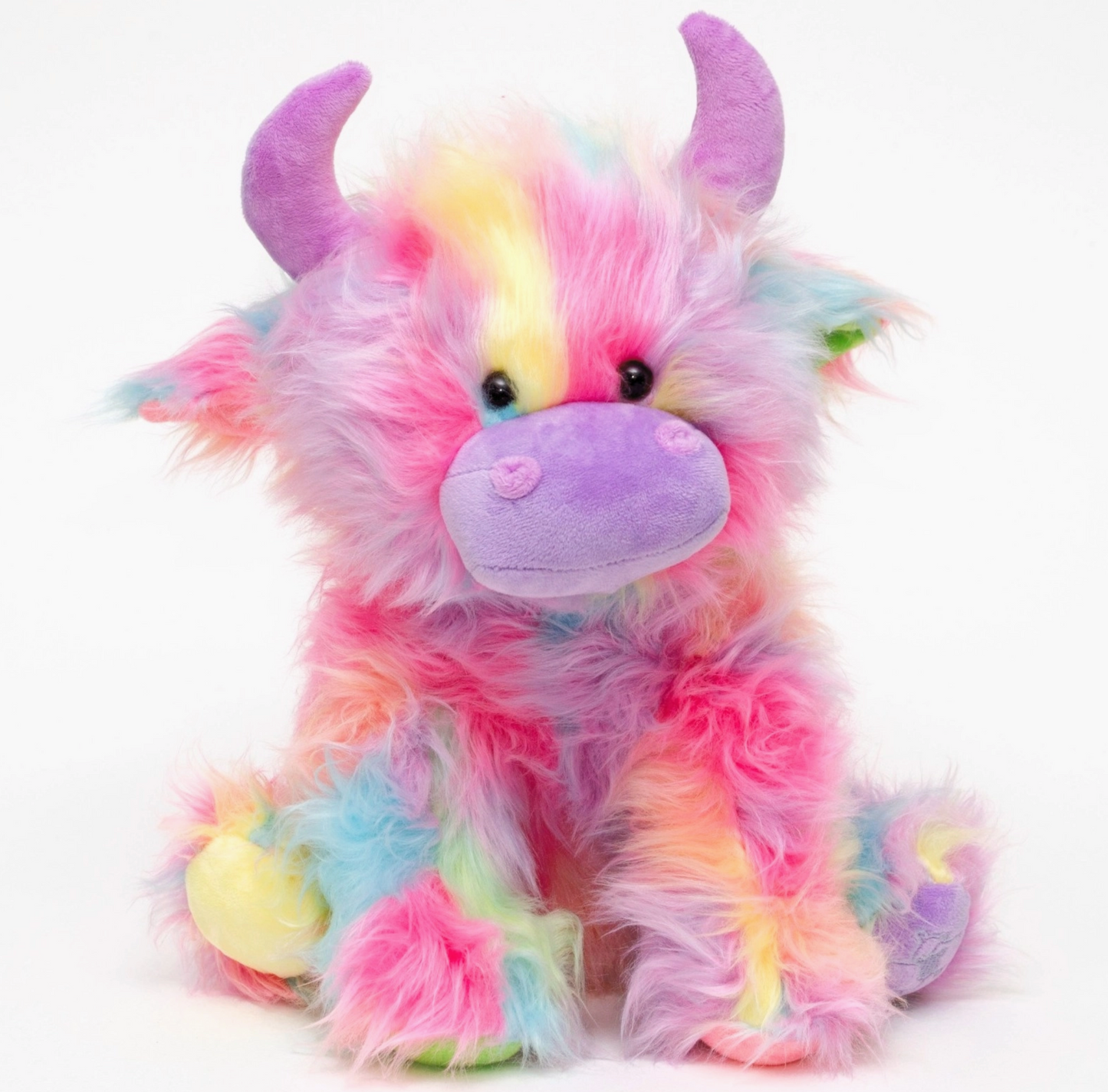 Colorful plush toy with horns on a white background