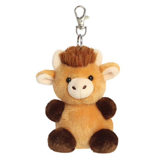 Plush cow keychain with a white background