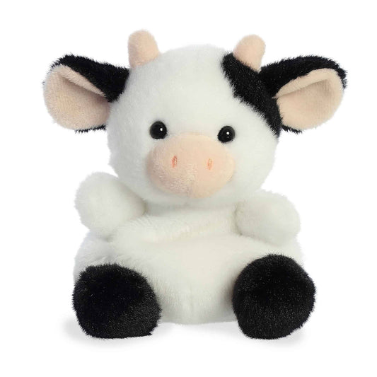Plush cow toy with black and white pattern on a white background