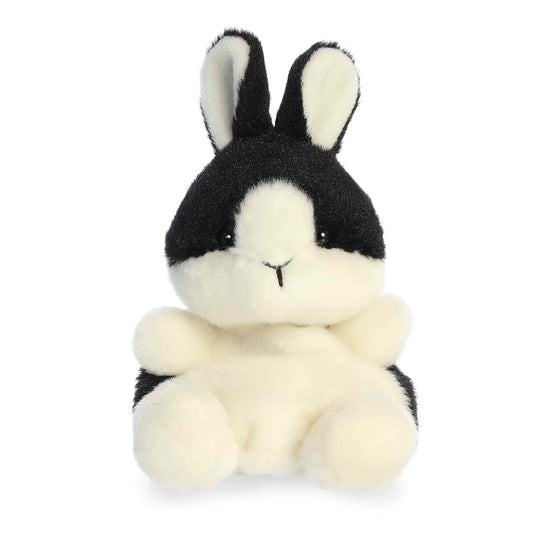 Black and white plush bunny toy on a white background